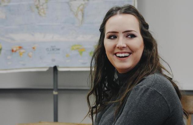 student smiling in class